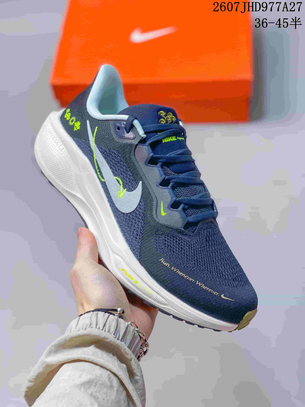 Angled side view of a navy Nike running sneaker with a white Swoosh, lime highlights, and white midsole.