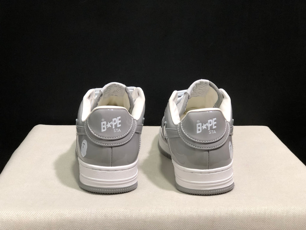 Rear view of the pair showing padded collars, heel branding and grey-white color blocking.