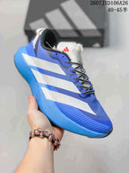 Close side view of the blue and white sneaker showing the layered side stripes, textured toe area, black-and-white laces and blue midsole.