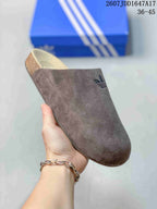 Angled top view of the brown taupe adidas Adimule clog showing the slip-on opening and tonal Trefoil logo.