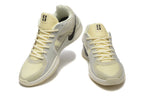 Pair of pale yellow and light gray Nike Kobe 5 Protro shoes shown from front and side