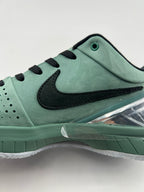 Close-up of the green side panels, black Swoosh and lace area
