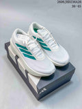 Pair of white adidas ZenBoost low-top shoes with green side stripes, shown on a shoebox.