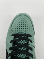 Top-down close-up of the toe perforations and black laces