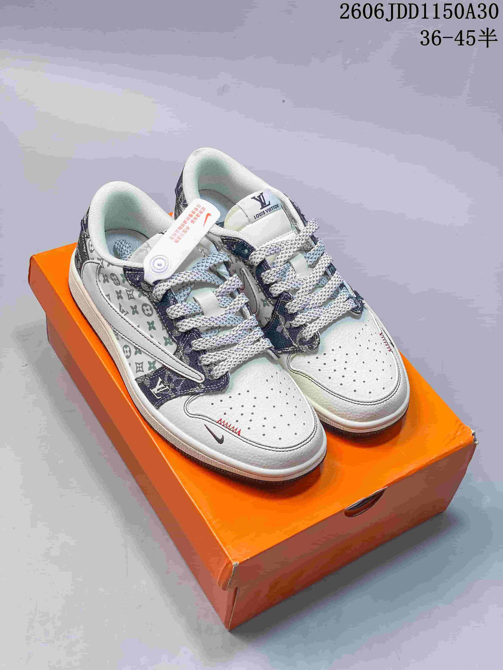 Pair of white and denim-look low-top sneakers with patterned panels and gray laces
