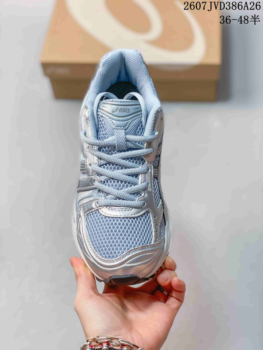 Top view showing the mesh toe box, laces, tongue, and padded collar.
