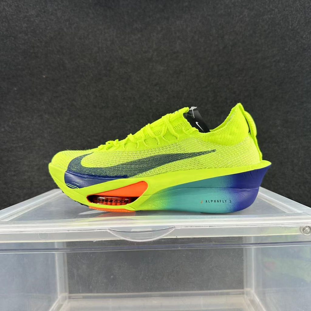 Side view of a neon green Nike Alphafly 3 running shoe with a dark Swoosh, blue-green midsole and orange forefoot detail.