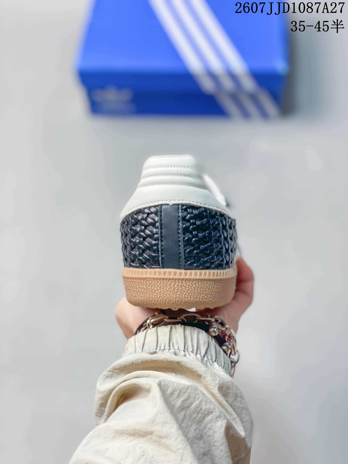 Rear view of the sneaker showing the dark woven-texture heel, white padded collar, and gum-colored sole.