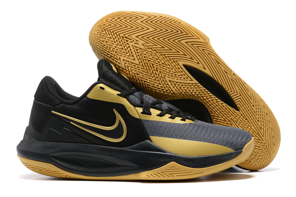 Black and gold basketball shoe with a gum-colored patterned outsole.
