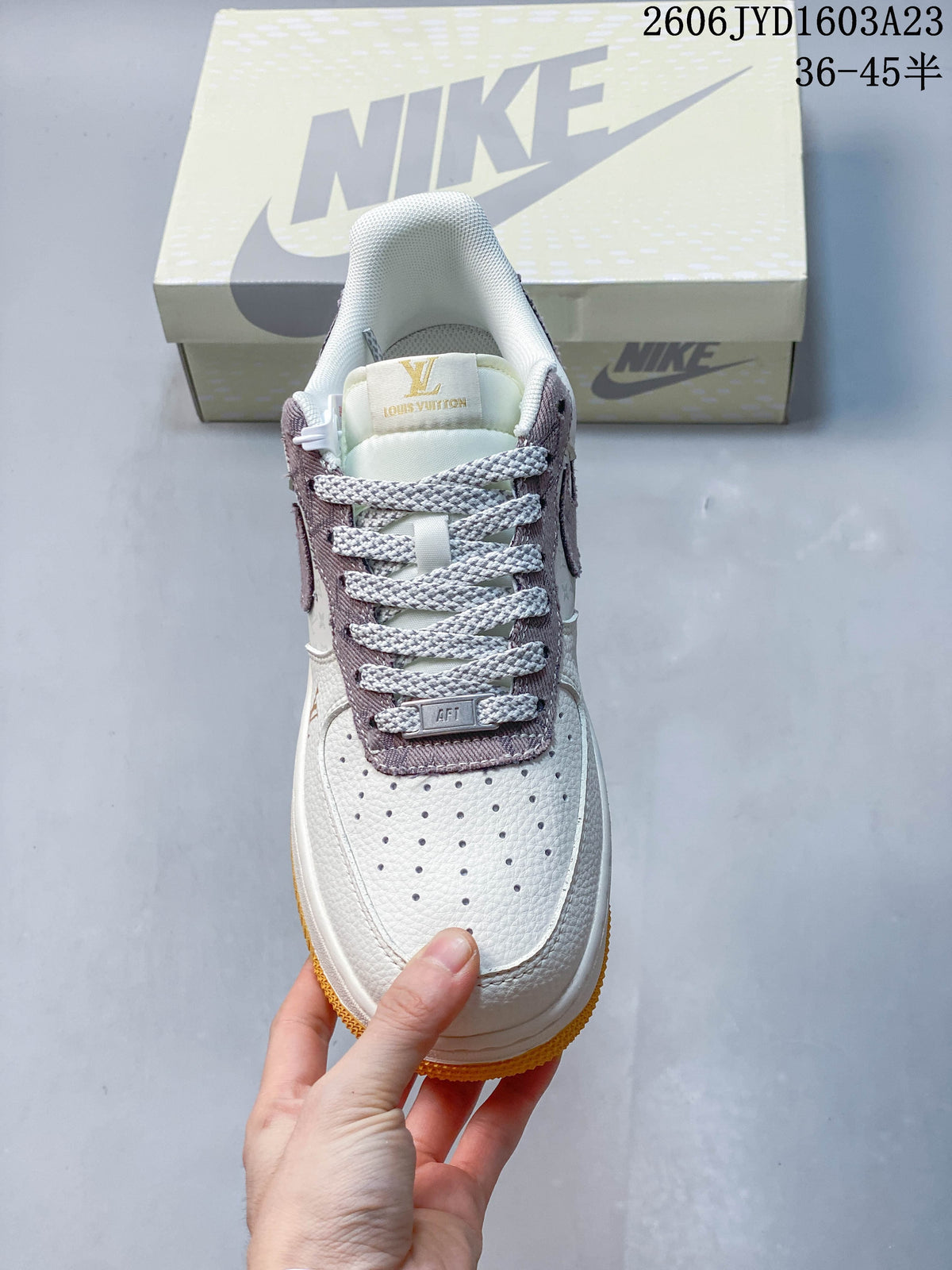 Top view showing the perforated toe, contrast laces, and mauve lace panel.