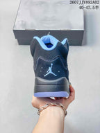 Rear view of the dark low-top sneaker with a light blue collar and heel logo