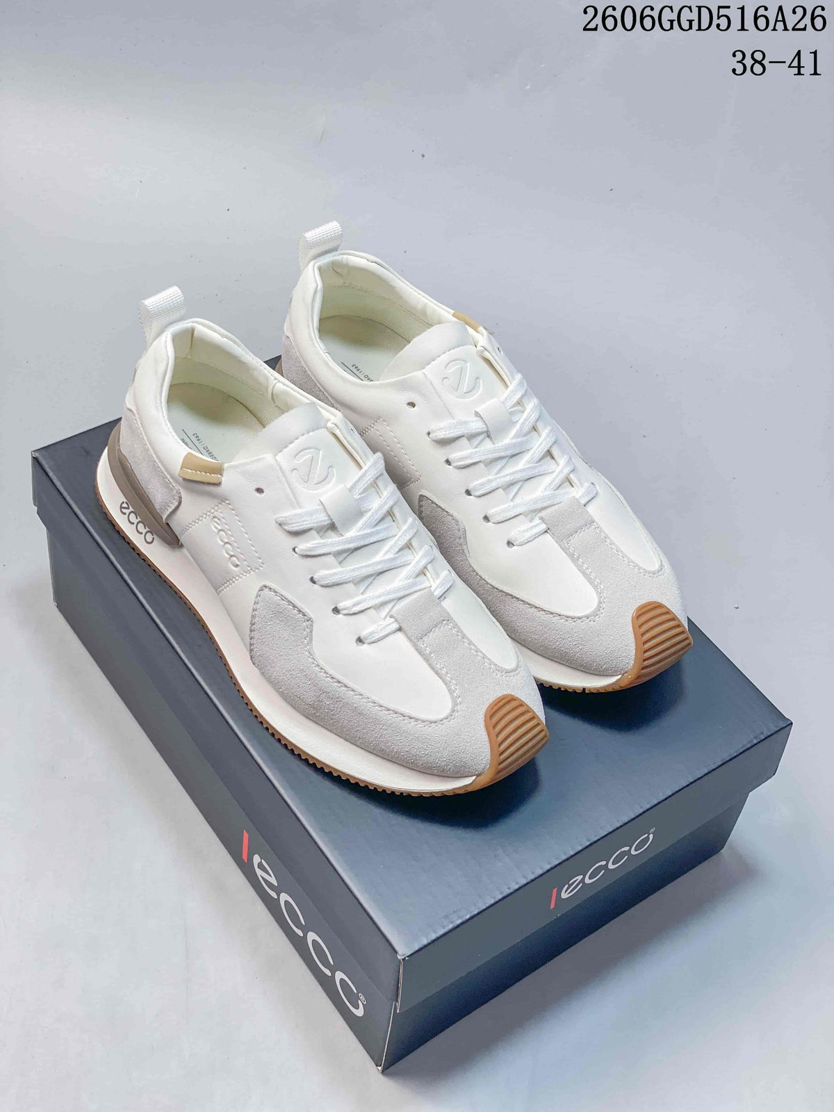 White and navy ECCO lace-up sneakers shown together from the front, with gum-colored toe details.