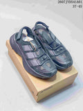 Pair of dark gray adidas Terrex Free Hiker SL CC outdoor shoes on a box