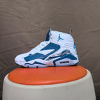 Side view of a white and blue high-top sneaker with a patterned side accent