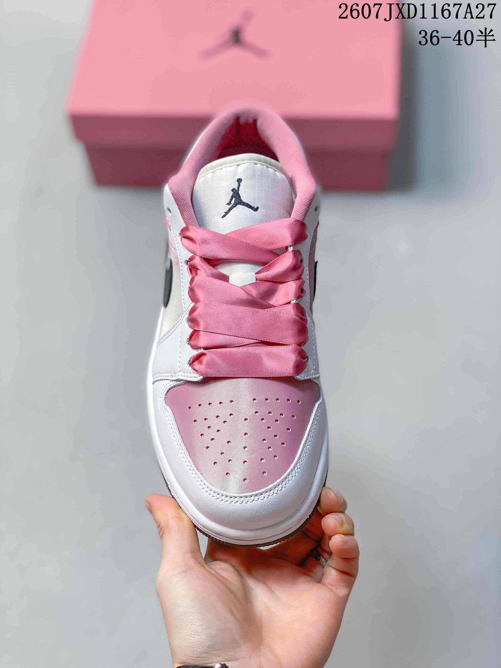 Top view showing the perforated pink toe box, white overlays, and wide pink laces.