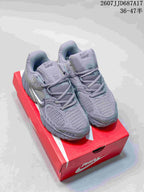 Gray Nike V5 RNR sneakers shown from the front on a red shoe box, with the style code and size range visible above.