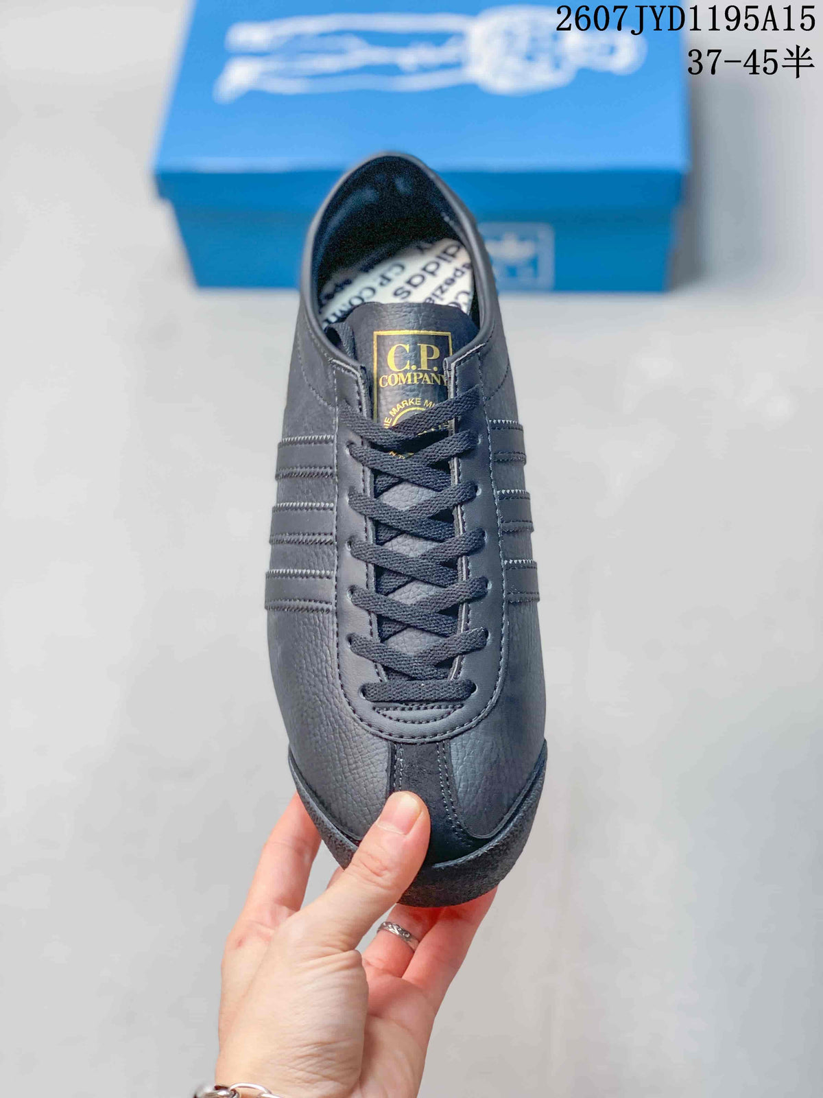 Top view of one sneaker showing the lace-up construction, tongue branding, and rounded toe.