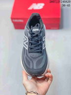 Top view showing the dark gray toe box, lace-up closure, tongue branding, and patterned upper.