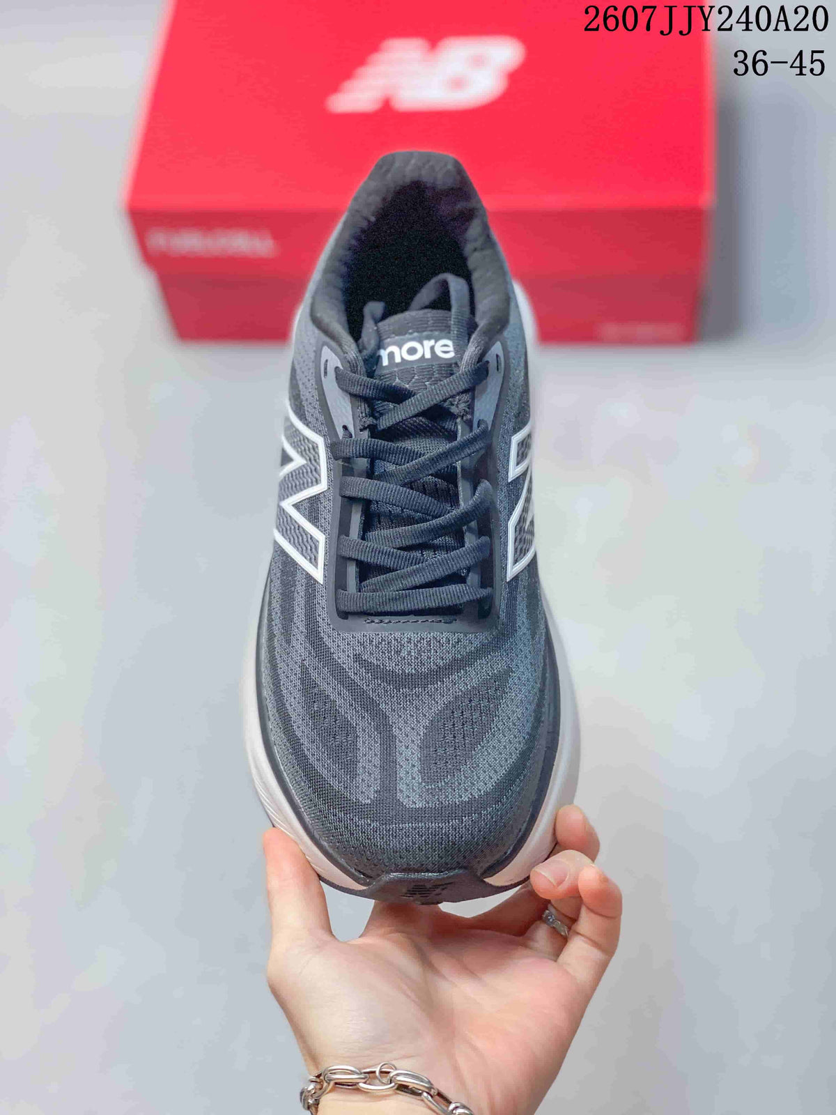 Top view showing the dark gray toe box, lace-up closure, tongue branding, and patterned upper.