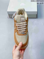 Top view of the sneaker showing the woven-texture toe box, cream laces, padded tongue, and tan lace panel.