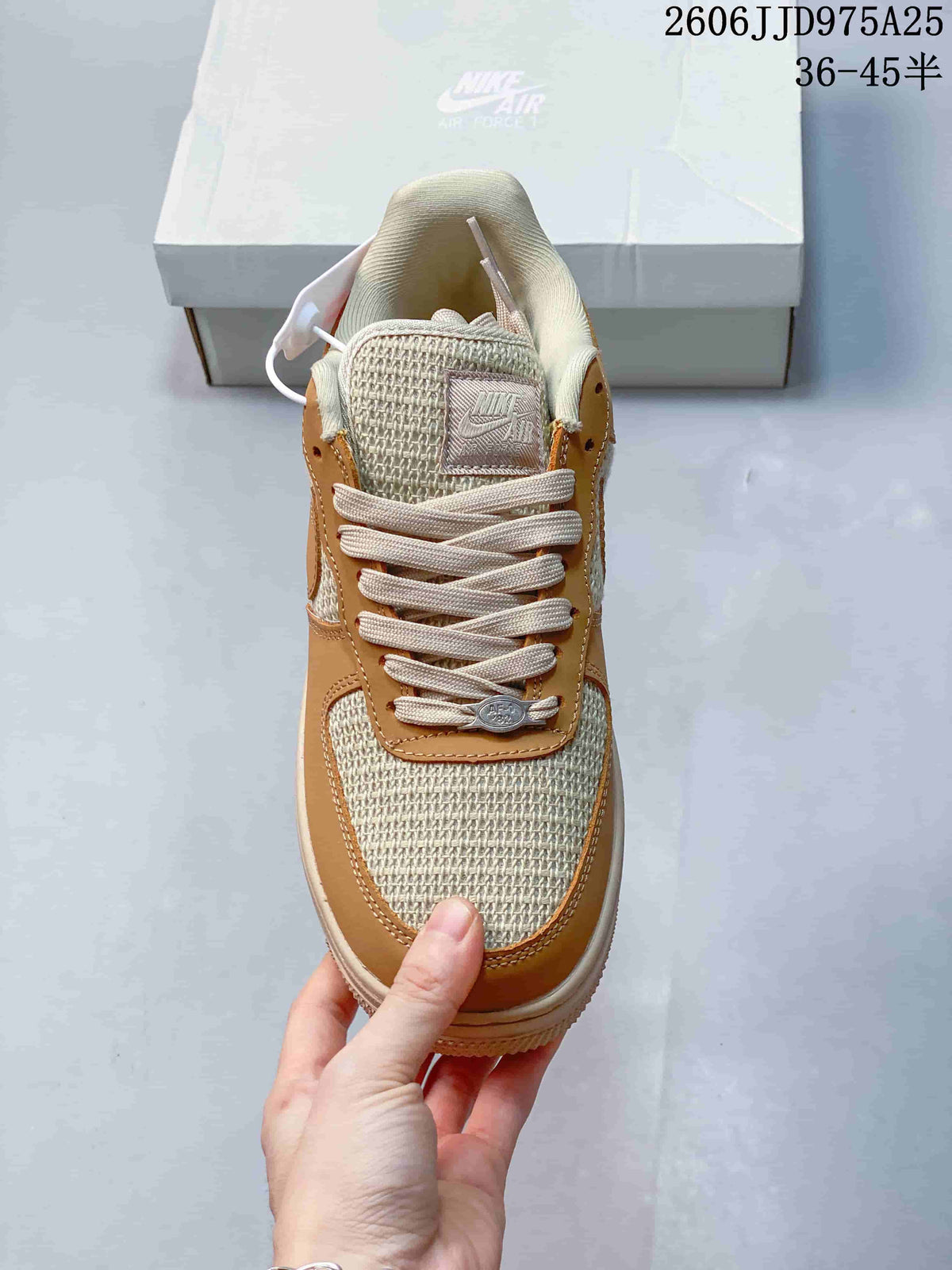 Top view of the sneaker showing the woven-texture toe box, cream laces, padded tongue, and tan lace panel.