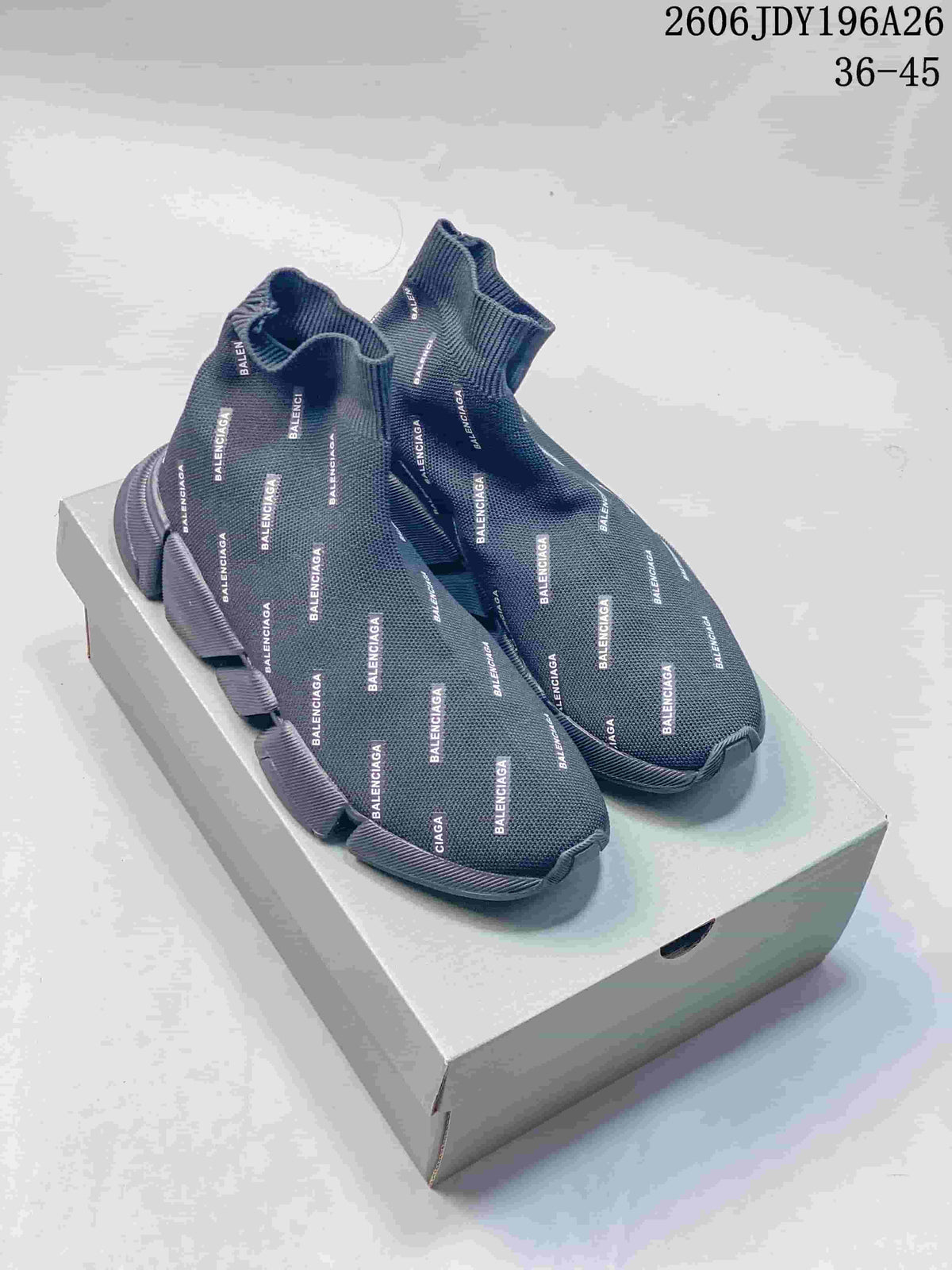 Pair of dark gray Balenciaga sock-style sneakers with repeated logo lettering, displayed on a shoe box.