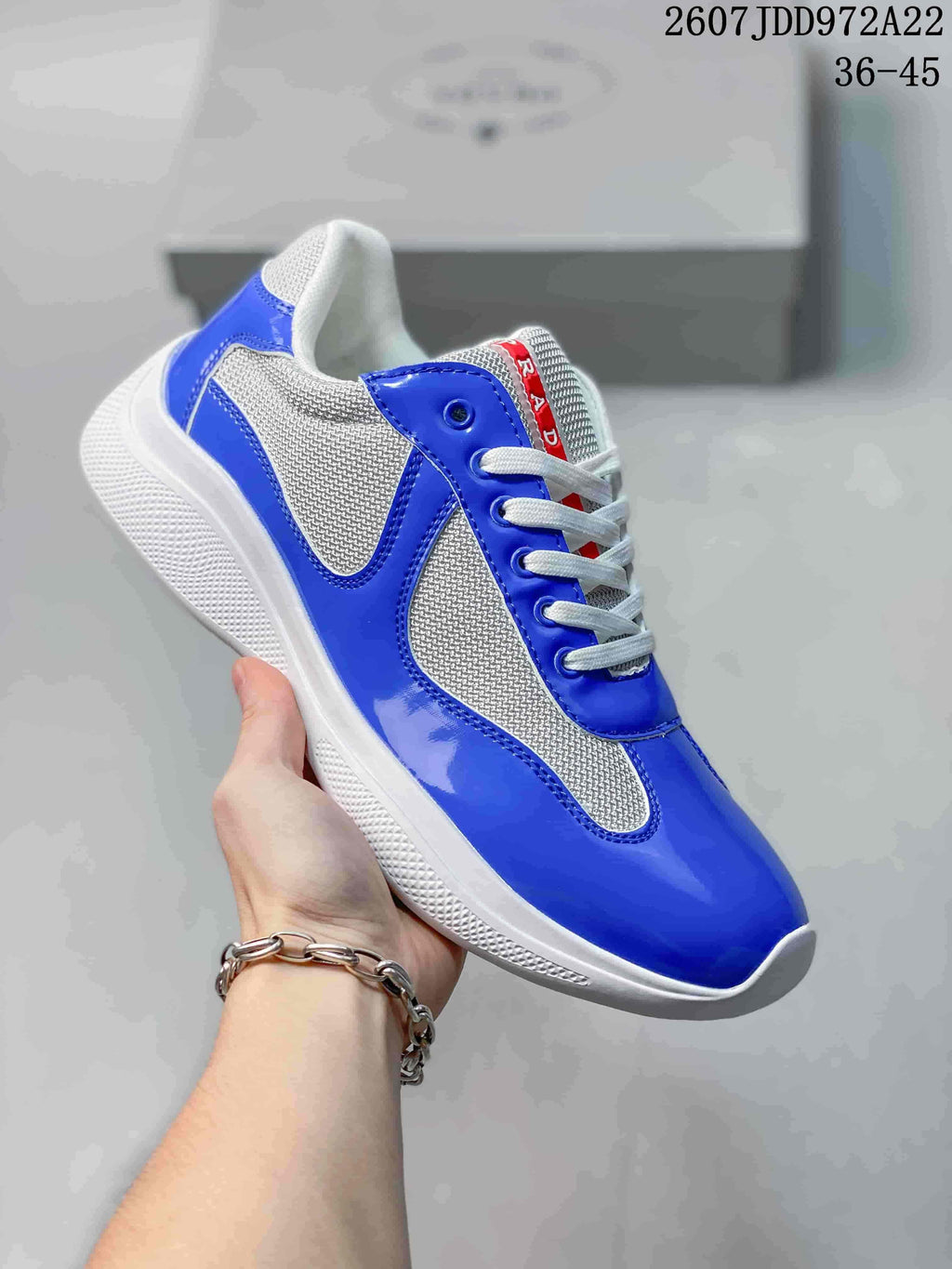 Royal blue and white Prada America's Cup low-top sneaker with textured side panels.