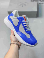 Royal blue and white Prada America's Cup low-top sneaker with textured side panels.