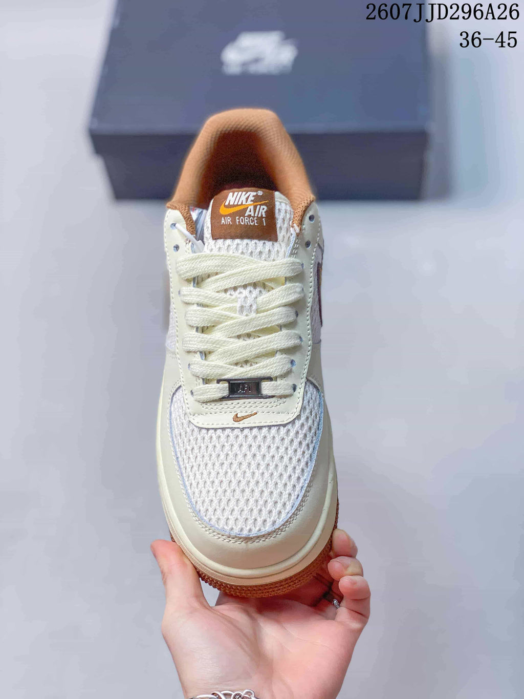 Top view showing the white mesh toe box, cream laces, brown tongue label, and metal lace ornament.