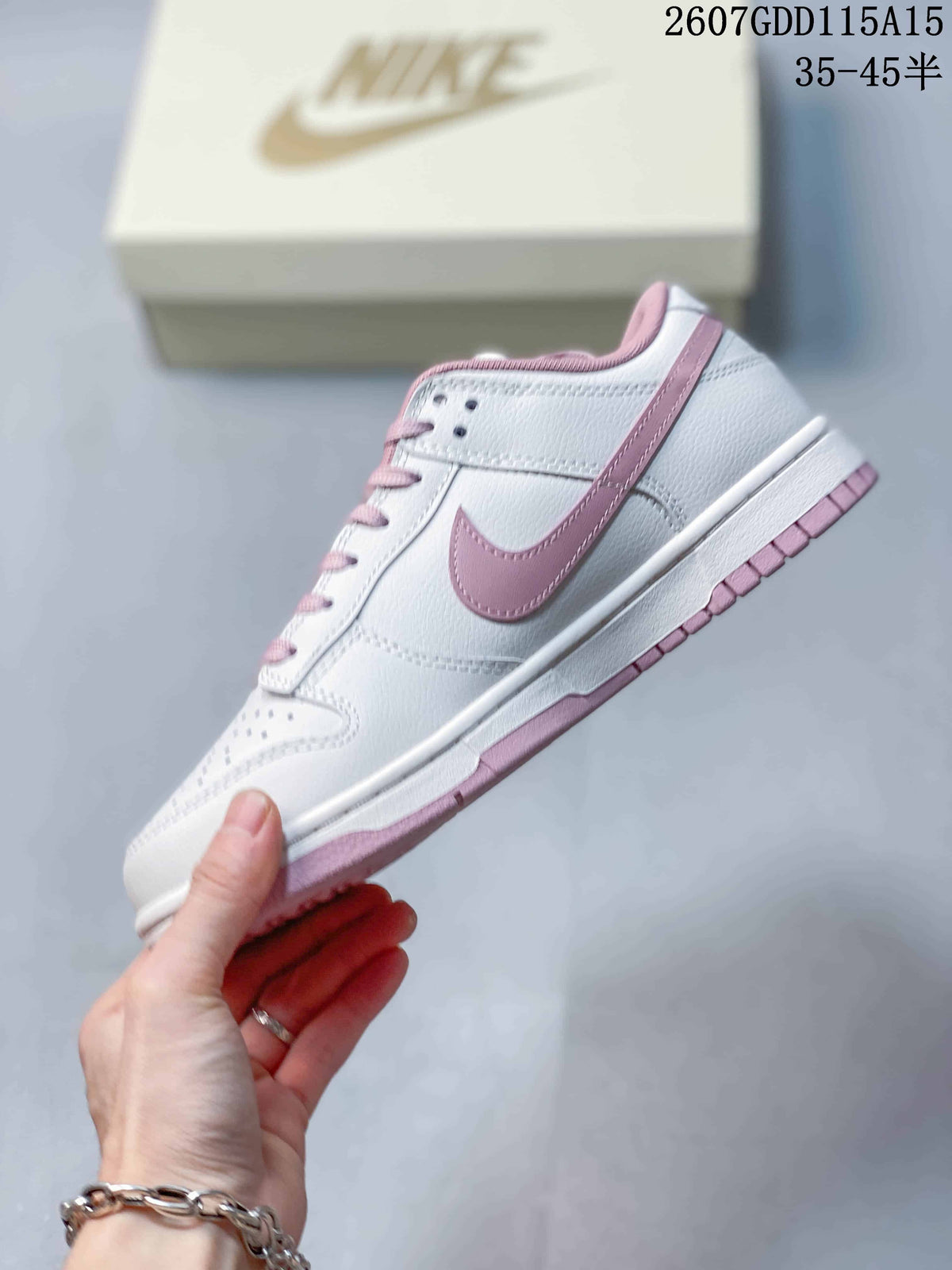 Side view of a white low-top sneaker with a pink Swoosh, white midsole, and pink outsole; image text shows style code 2607GDD115A15 and size range 35–45.