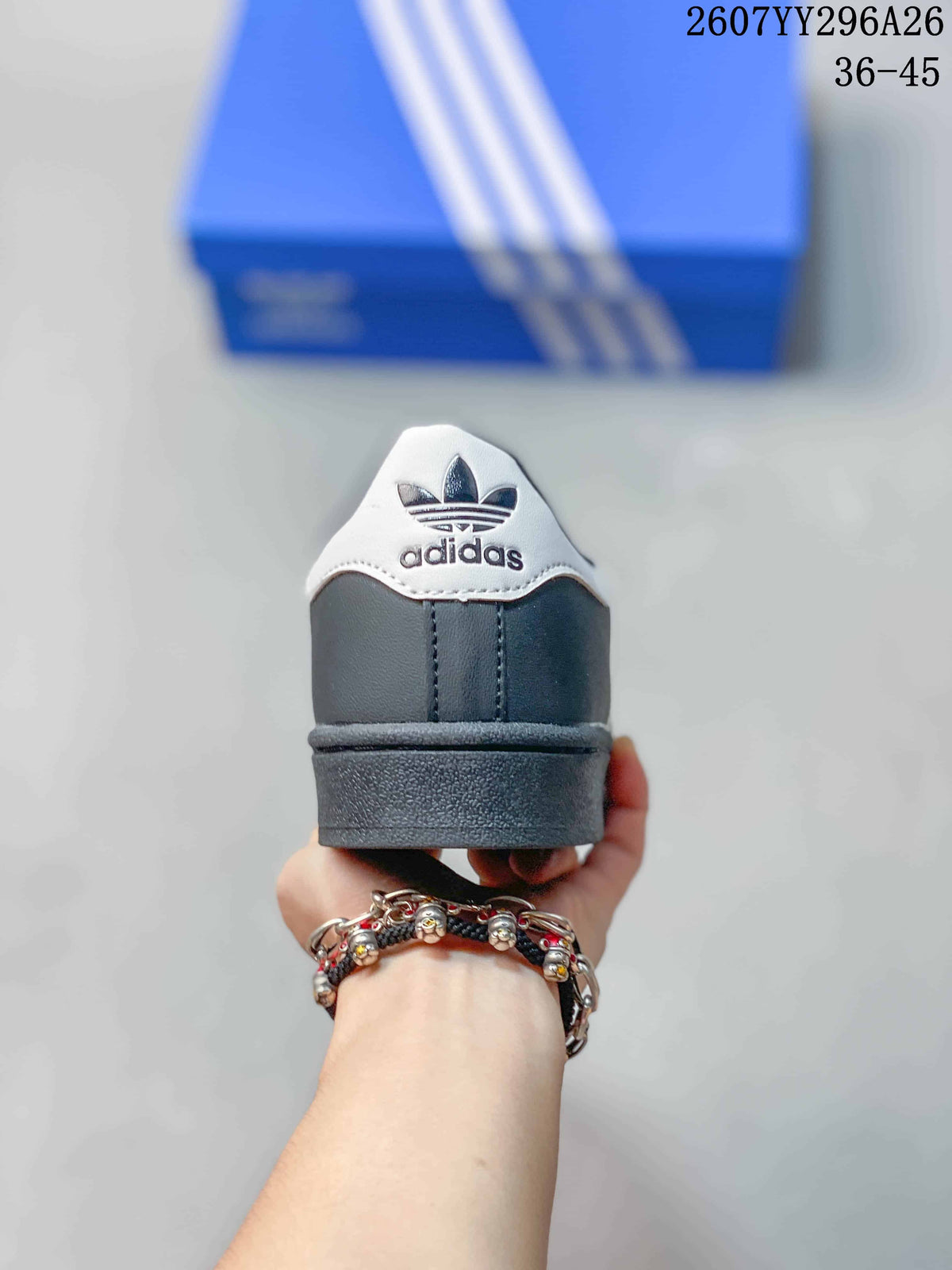 Rear view showing the white heel tab, adidas trefoil branding, dark heel panel, and rubber sole.