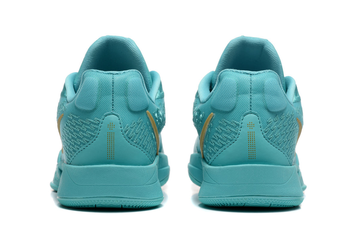 Rear view of the aqua basketball shoes showing heel panels and textured details.