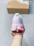 Rear view of the white and pink sneaker showing the heel construction, pull tab and visible On branding.