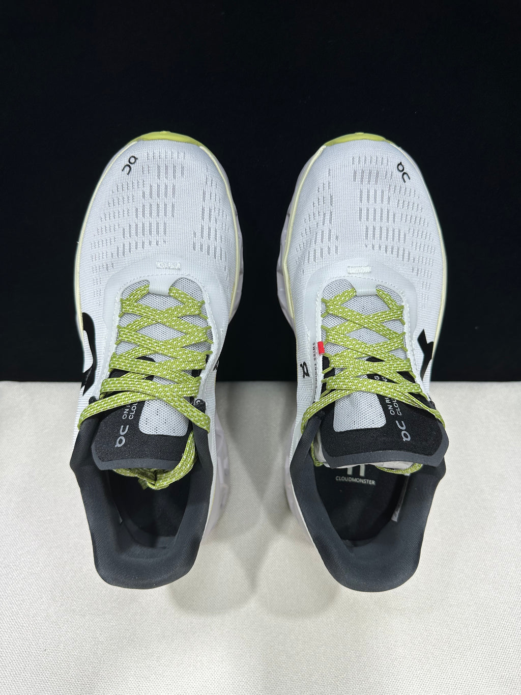 Top view of the pair showing the laces, uppers, and dark collars.