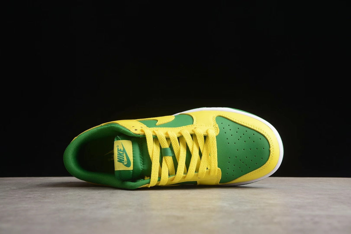 Top view showing the green perforated toe box, yellow laces, and padded collar.