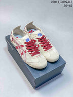 Pair of cream and red Onitsuka Tiger sneakers displayed on a branded shoebox