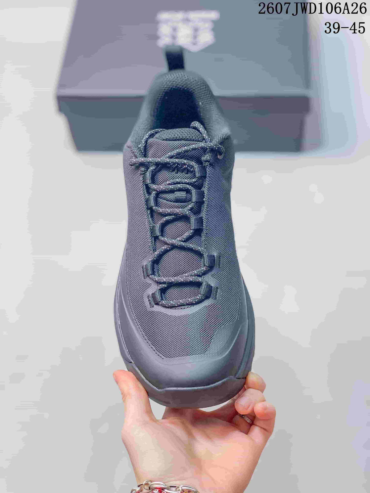 Top view of the hiking shoe showing the dark gray mesh-textured upper and layered lacing.