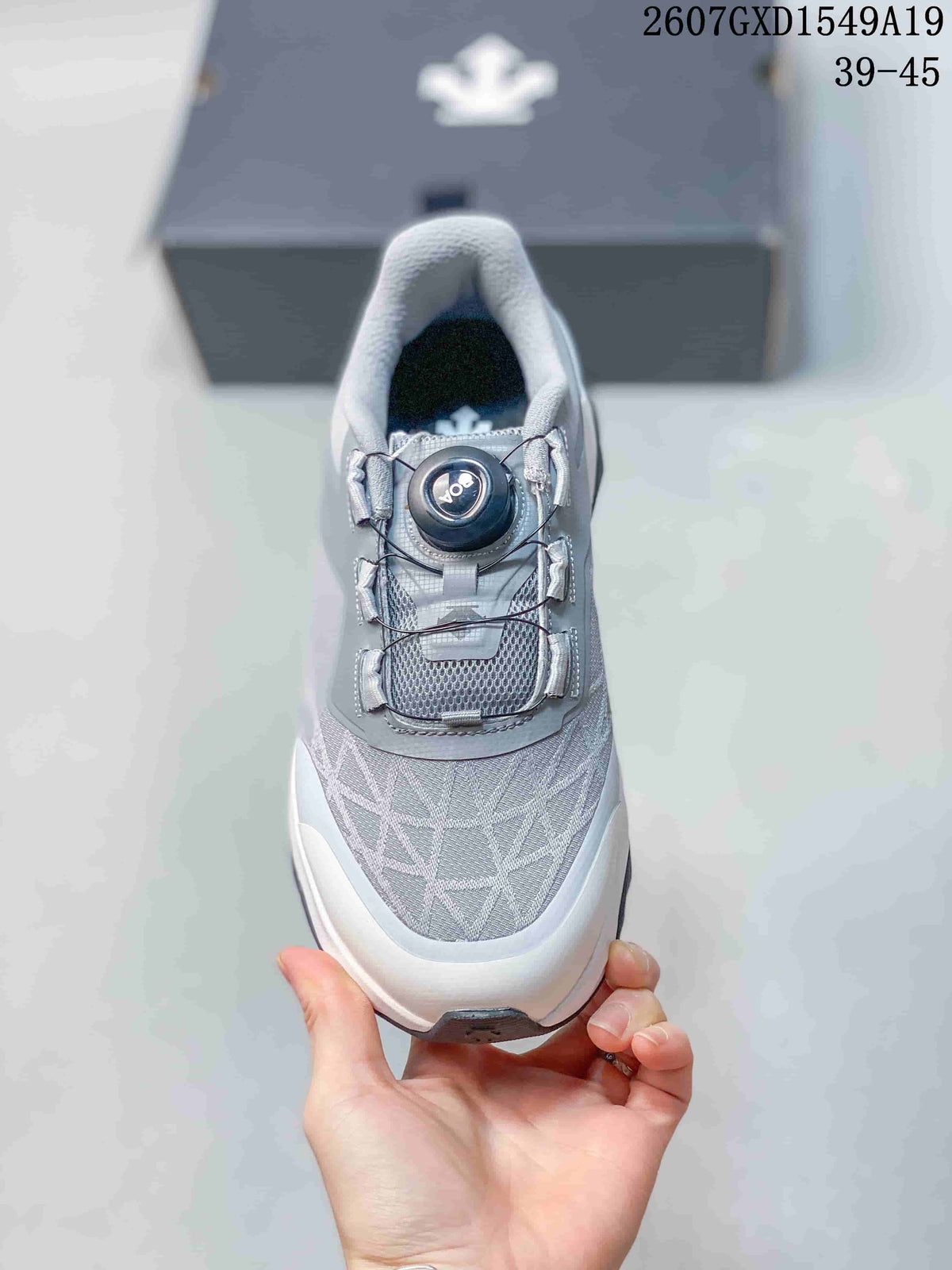 Top view of the sneaker showing the mesh-like toe panel, dial closure and lace routing.