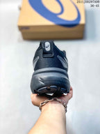 Rear view of the dark gray sneaker showing the padded heel, pull tab, outsole, and visible PureGEL lettering.