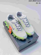 Pair of gray and neon green Nike Air Liquid Max sneakers displayed on a shoebox.