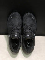 Top view of the black On Cloud X4 pair showing the lace-up construction and textured uppers.