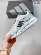 Side profile of the white low-top sneaker showing black side stripes, silver detailing and a segmented outsole; image text shows style code 2607JHY497A17 and size range 39–45.
