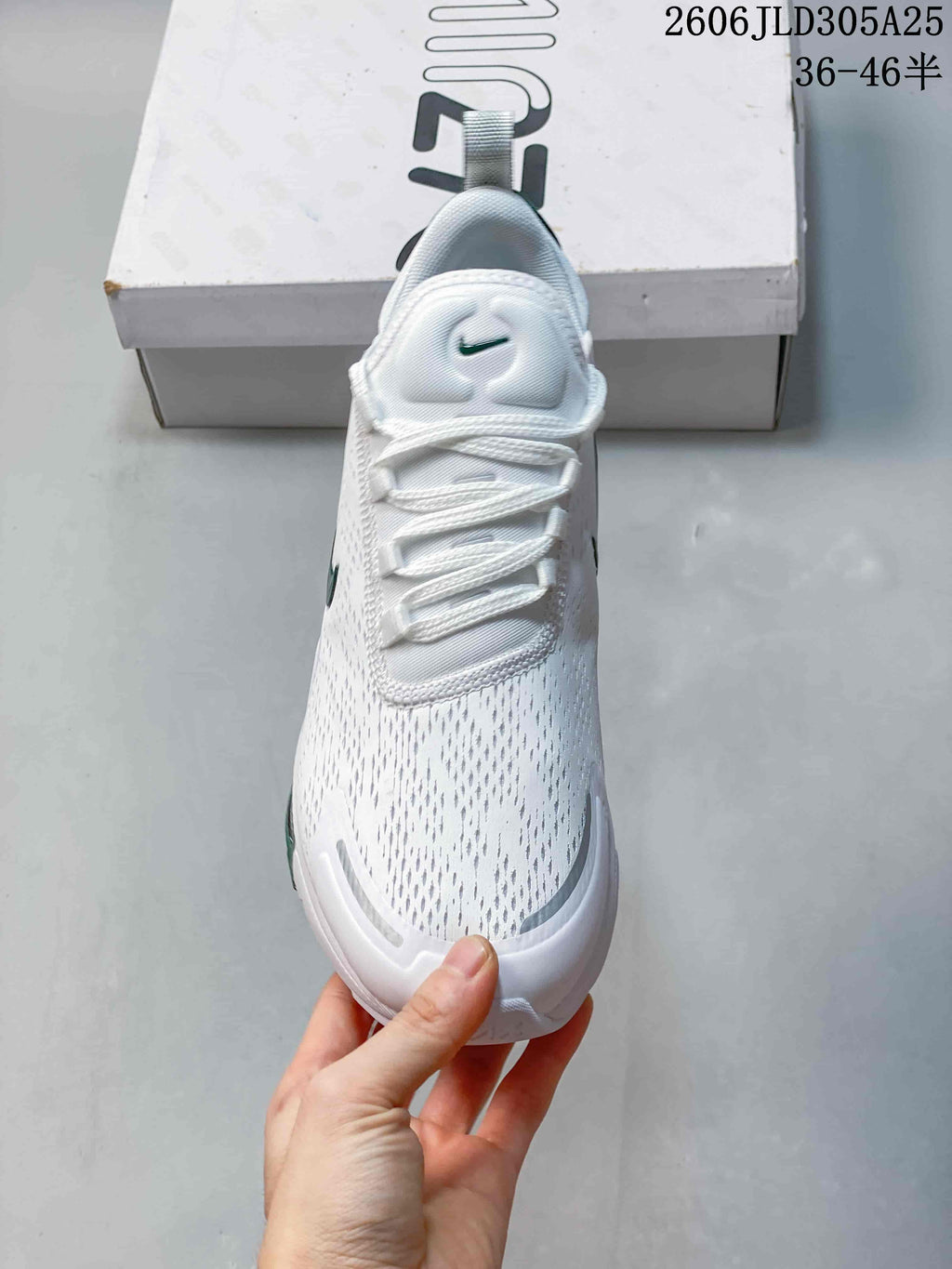 Top view showing the laces and patterned white upper