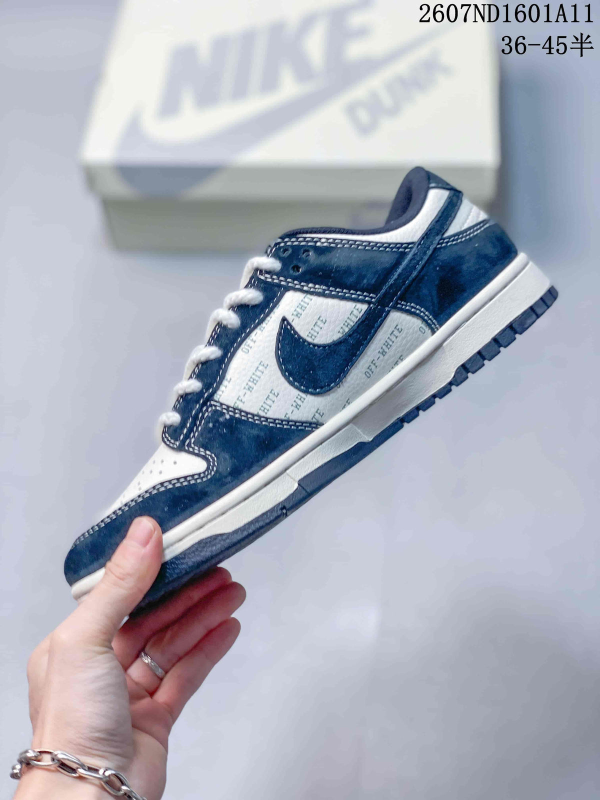 Side view highlighting the navy overlays, white panels with repeated OFF-WHITE text, contrast stitching, and Nike Swoosh.