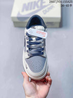 Top view of the sneaker showing dark navy laces, a grey perforated toe panel, white overlays and Nike SB tongue branding.