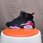 Side view of a black high-top sneaker with red detailing and visible heel unit