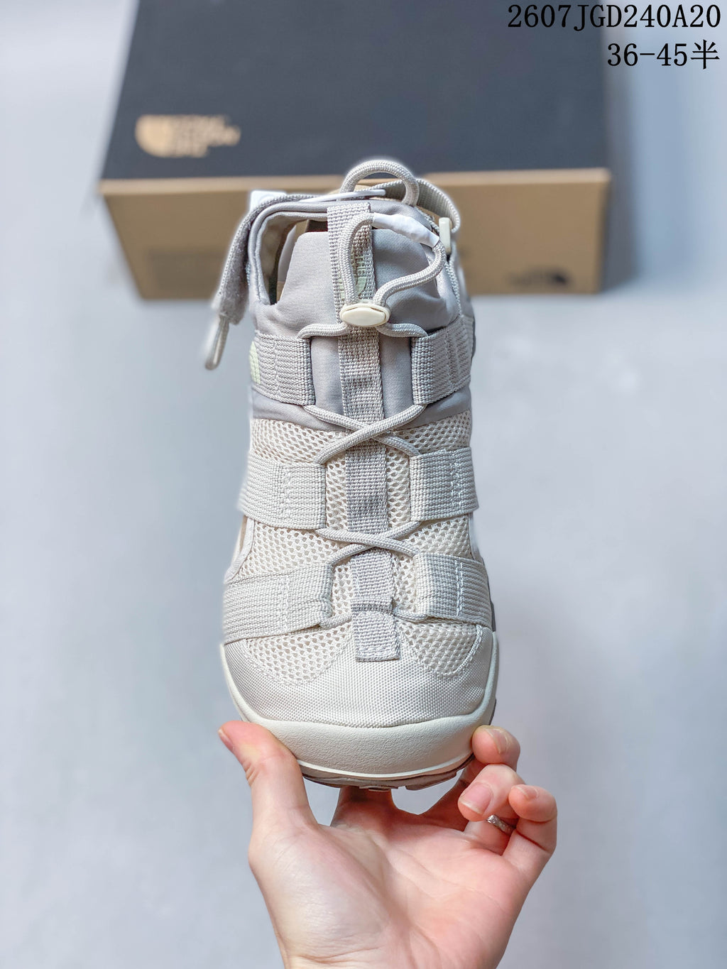 Top view of the sandal showing the layered strap arrangement, mesh panels, and toggle-style fastening.