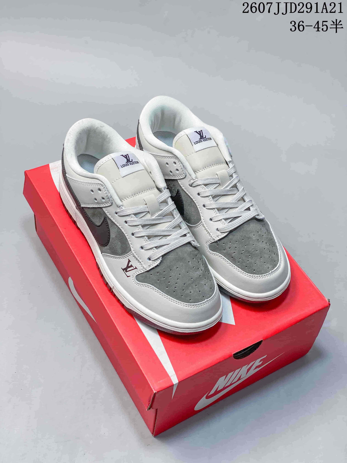 Pair of white and grey low-top sneakers displayed on a red Nike shoebox, with visible Nike and Louis Vuitton branding and style code 2607JJD291A21.