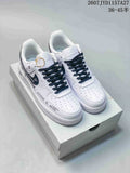 Pair of white and black Nike Air Force 1 ’07 low-top sneakers displayed on a shoebox, with code JYD1157A27 and size range text visible above.