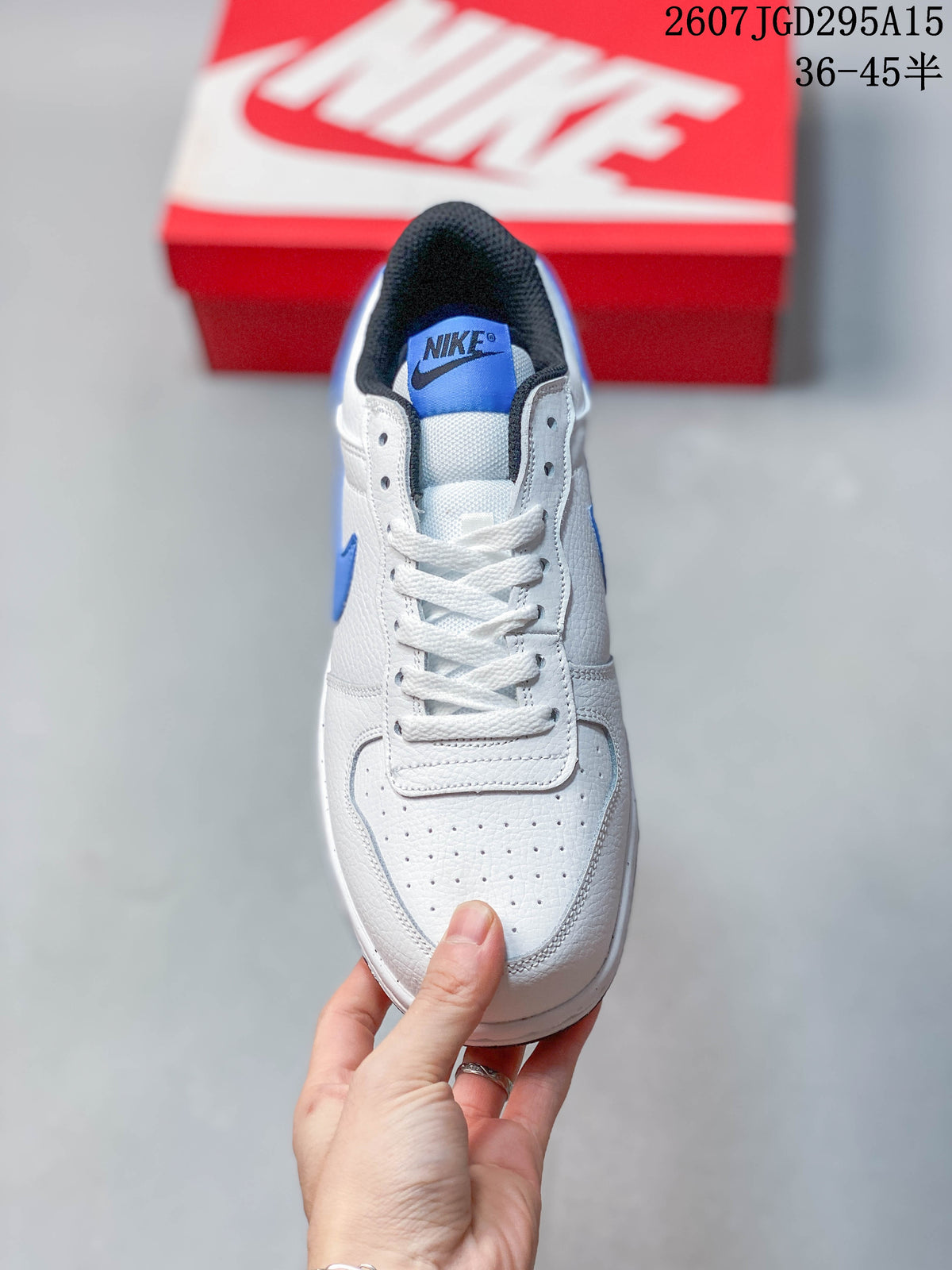 Top view showing the perforated toe box, white laces and blue tongue label.